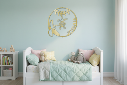 Our Little Monkey Monogram Steel Sign mounted on a wall in a bright cheerful children's bedroom with pastel colors and cozy bedding