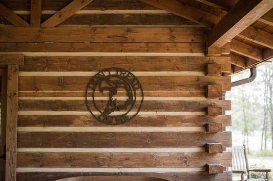 Eagle Head Ring Monogram stone finish hanging on log home porch