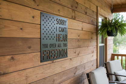 Black All This Freedom metal sign mounted on a front porch wall