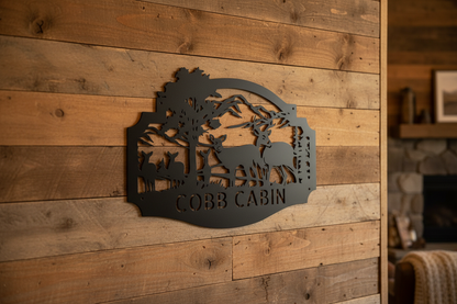 Deer Family Monogram Steel Sign hanging on a rustic cabin wall